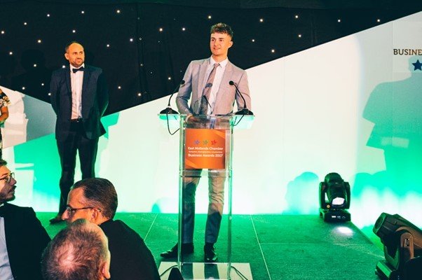 Solutions employee George Dennis giving a speech when accepting an award