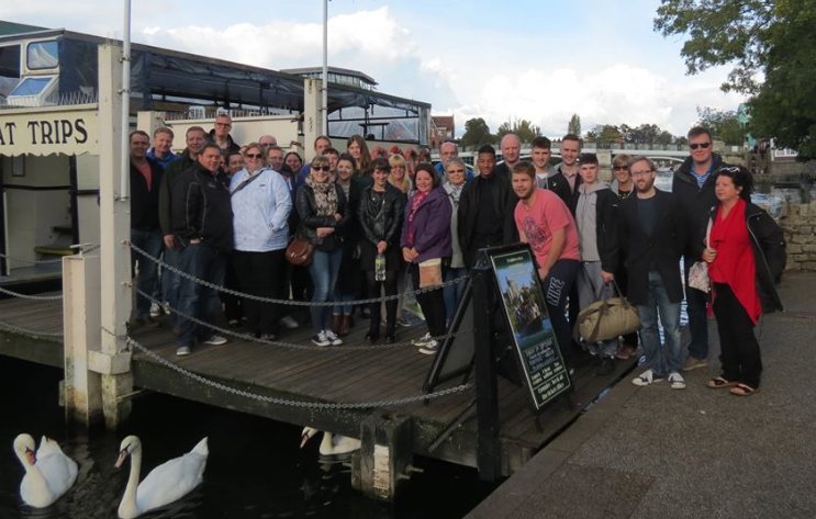 Solutions for Accounting staff posing outside a river cruise