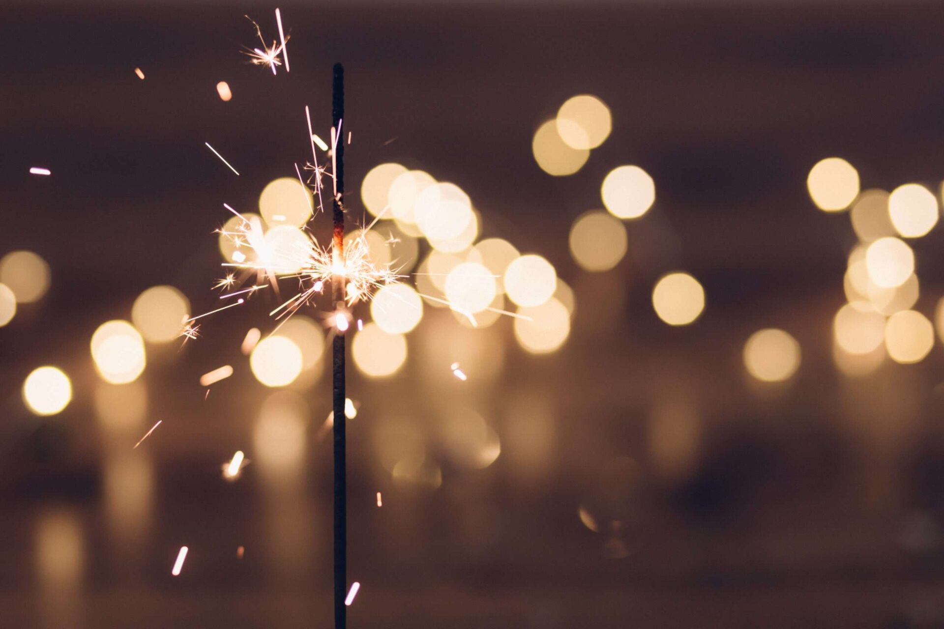 Close up of a sparkler burning creating a bokeh effect