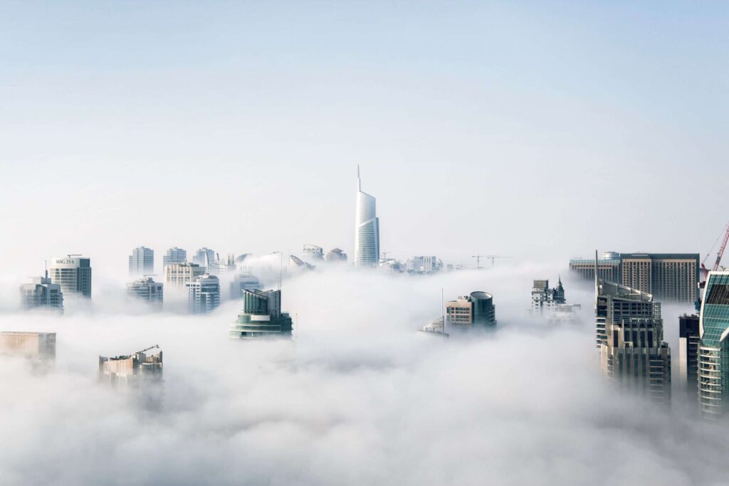 Tops of skyscrapers poking through above the clouds