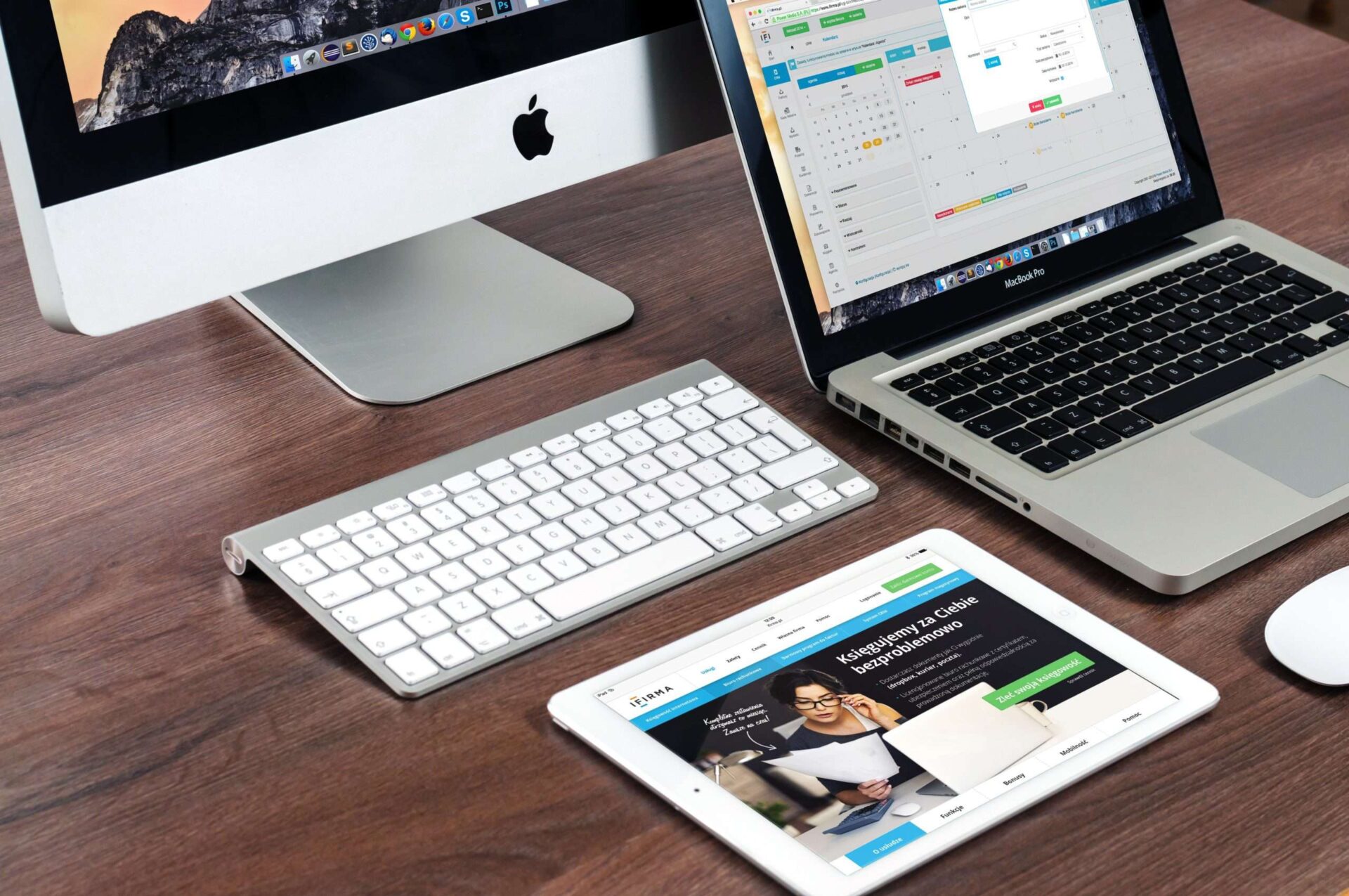 Apple mac laptop and ipad showing software being used
