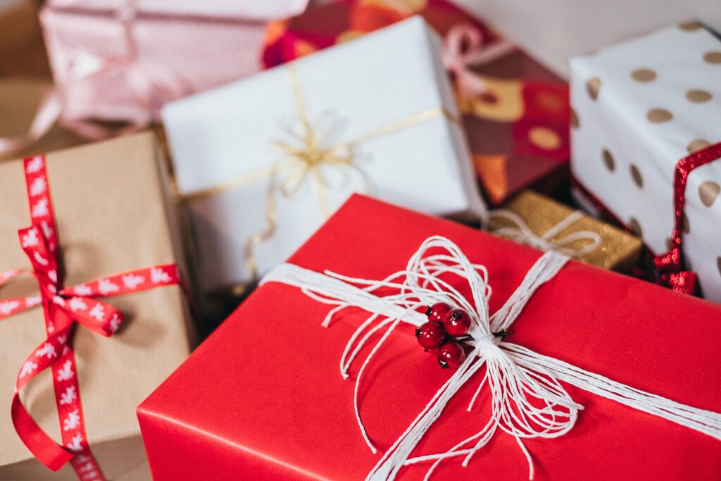 Close up of unopened Christmas presents in colourful wrapping paper