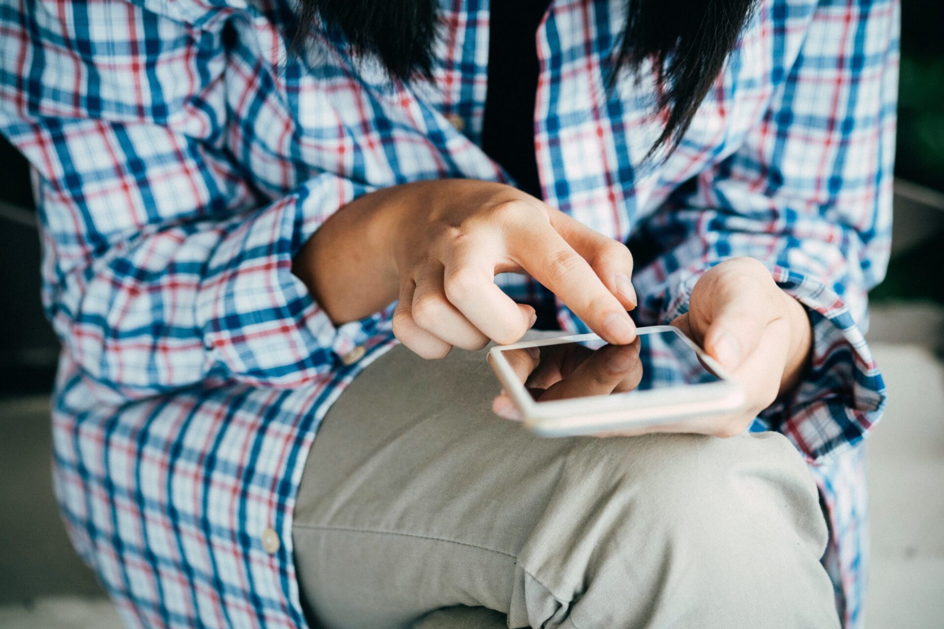 Close up of a person looking at something on her phone