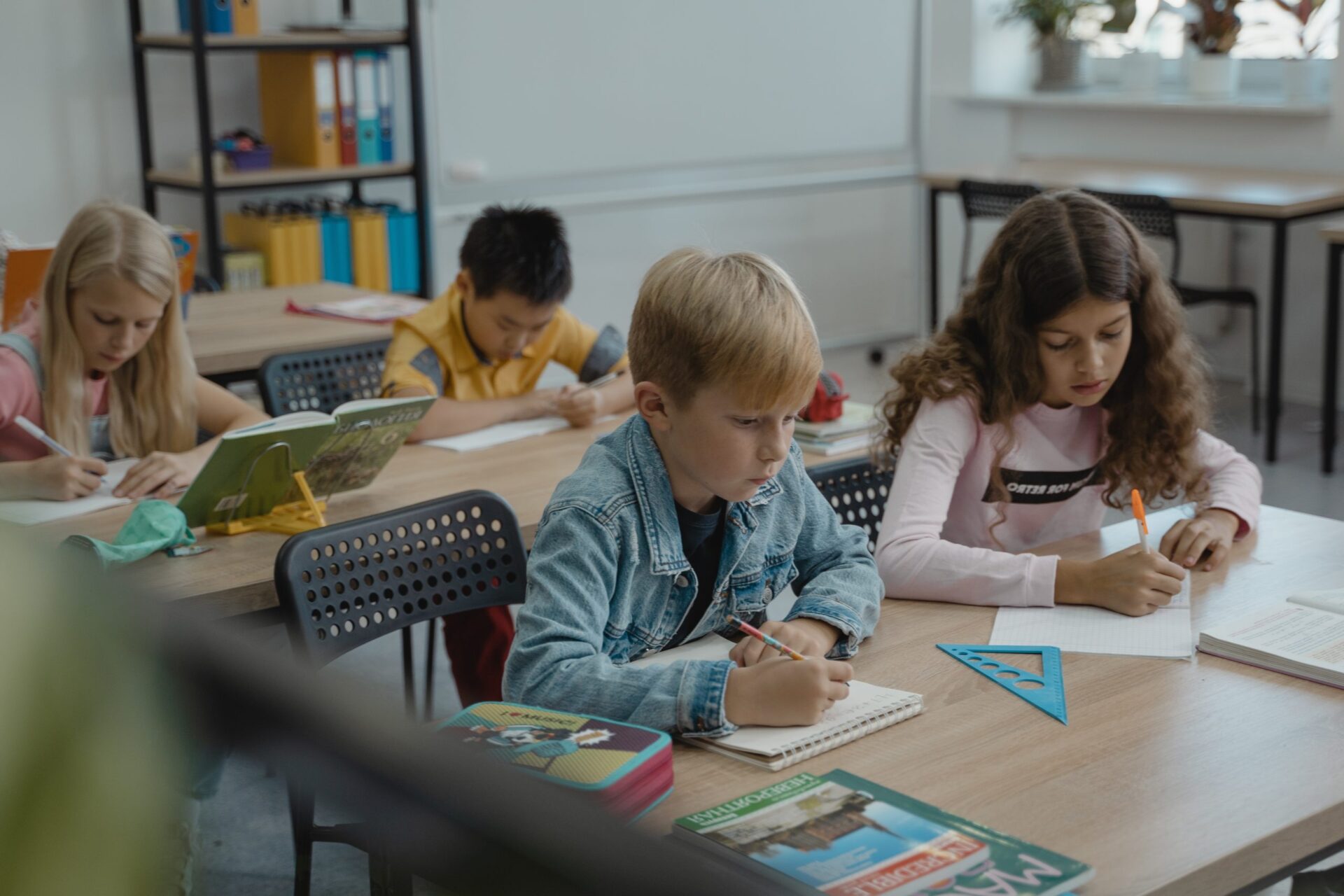 School children working at desks at school
