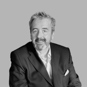 Solutions employee Derek Curtis black and white profile photo