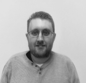 Solutions employee Adam Brailsford black and white profile photo