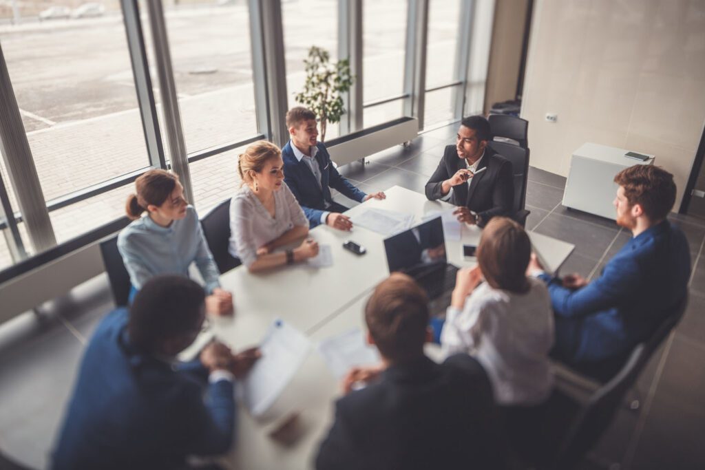 Professional business team meeting around a table