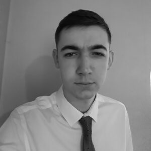 Solutions employee Alex Tokelove black and white profile photo