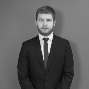 Solutions employee Gavin Huskinson black and white profile photo