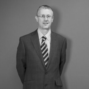 Solutions employee Mark Hearne black and white profile photo
