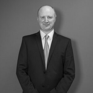 Solutions employee Nick Hempshall black and white profile photo