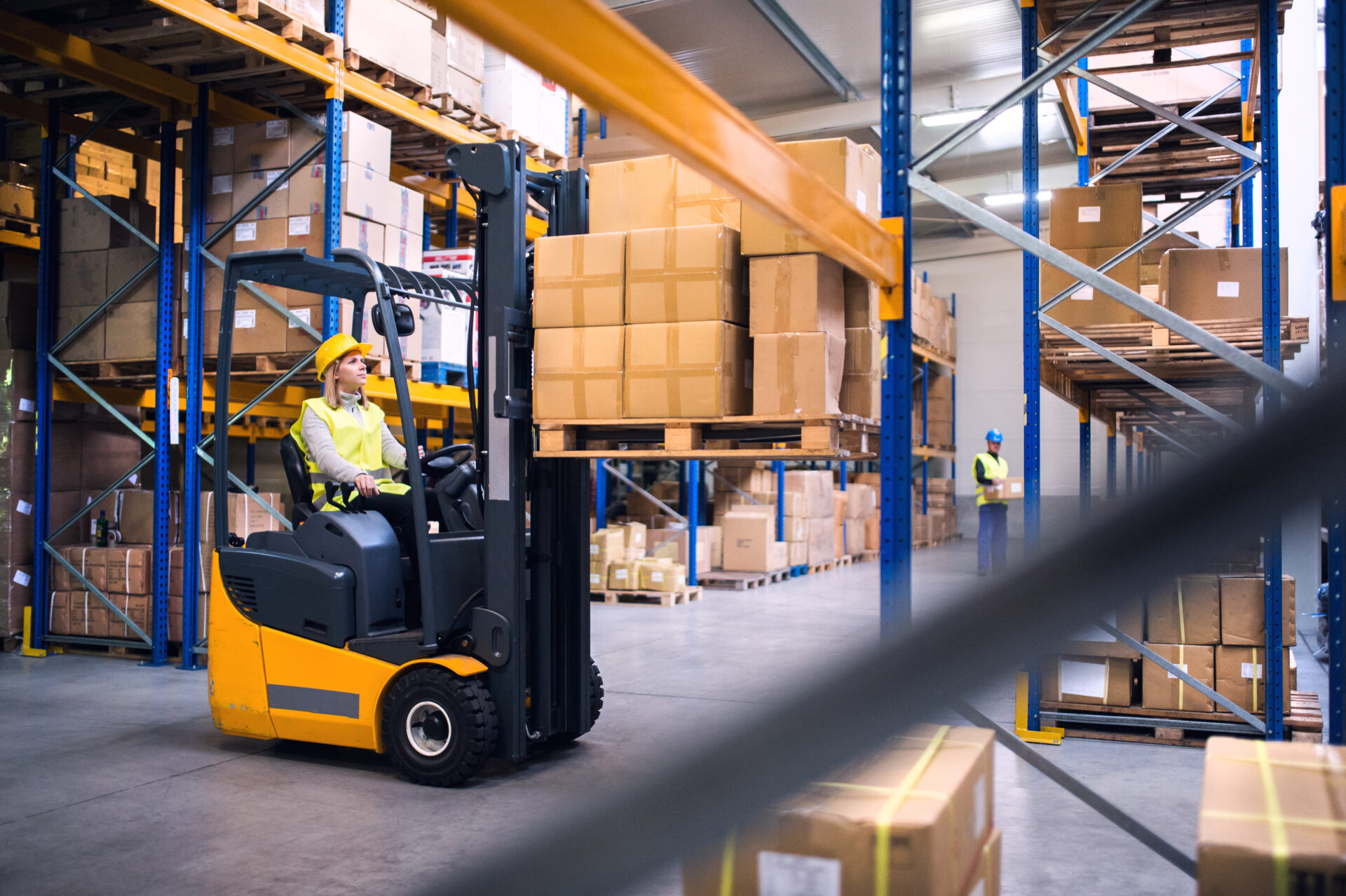 Adobe stock image of a forklift driver inside a warehouse