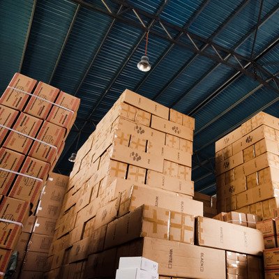 Image of stacks of cardboard boxes in a warehouse