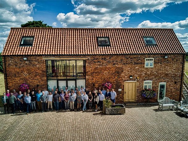 Solutions for Accounting team photo outside the new office at Holly Farm