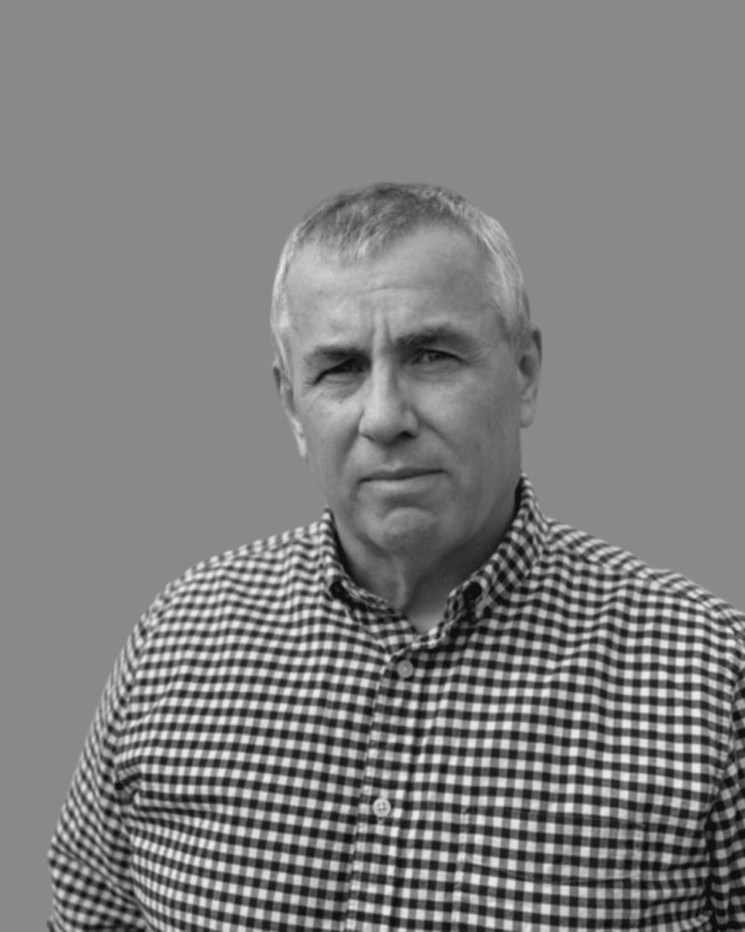 Solutions employee Tom Burke black and white profile photo