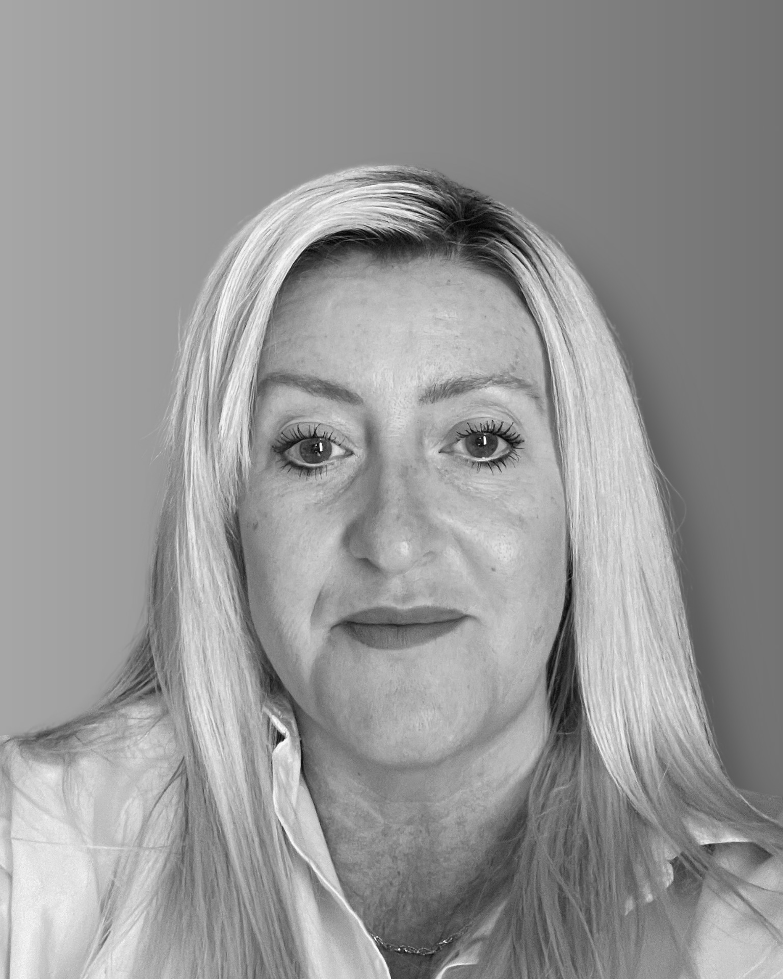 Solutions employee Kirie Hansen black and white profile photo