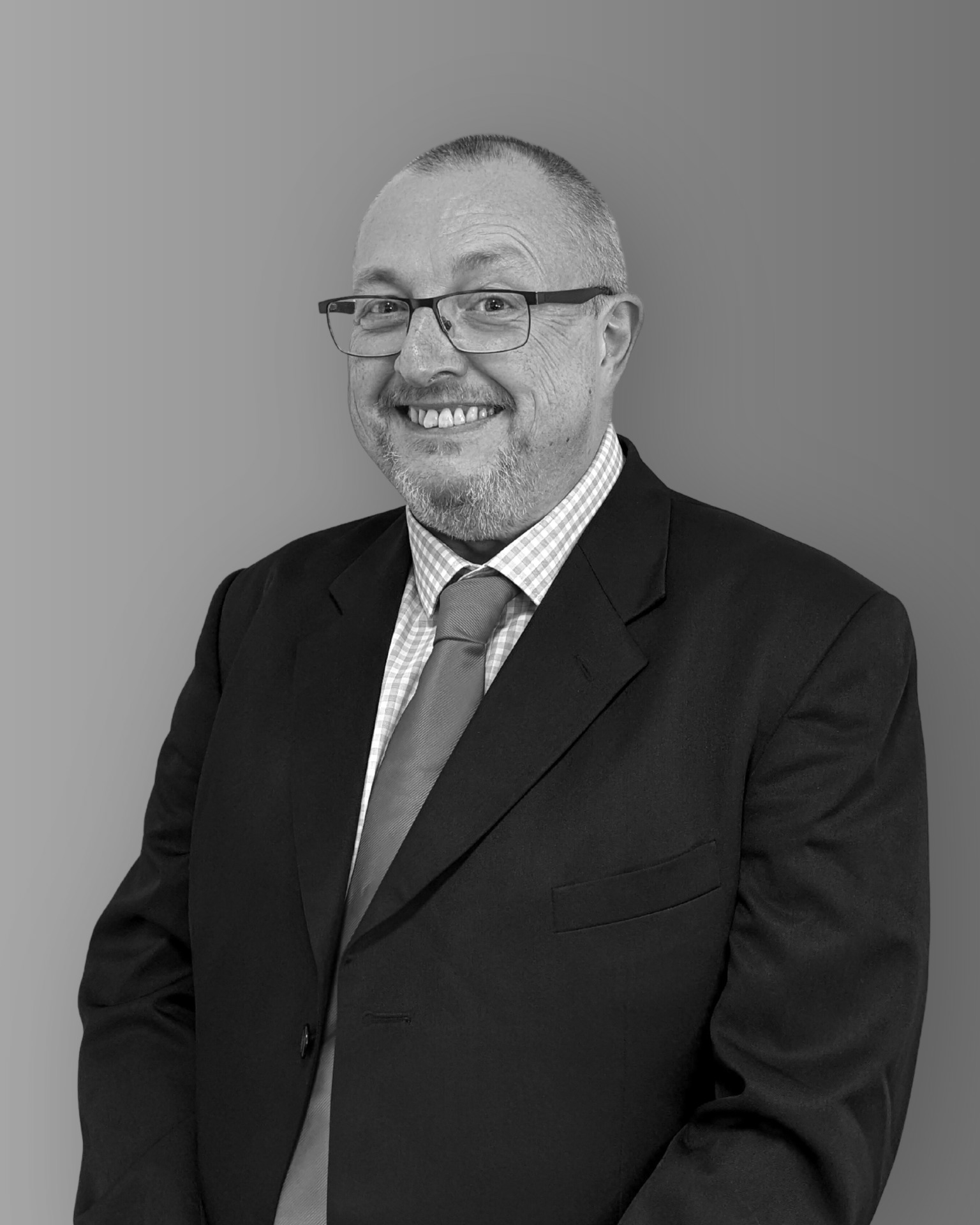 Solutions employee Paul Watts black and white profile photo