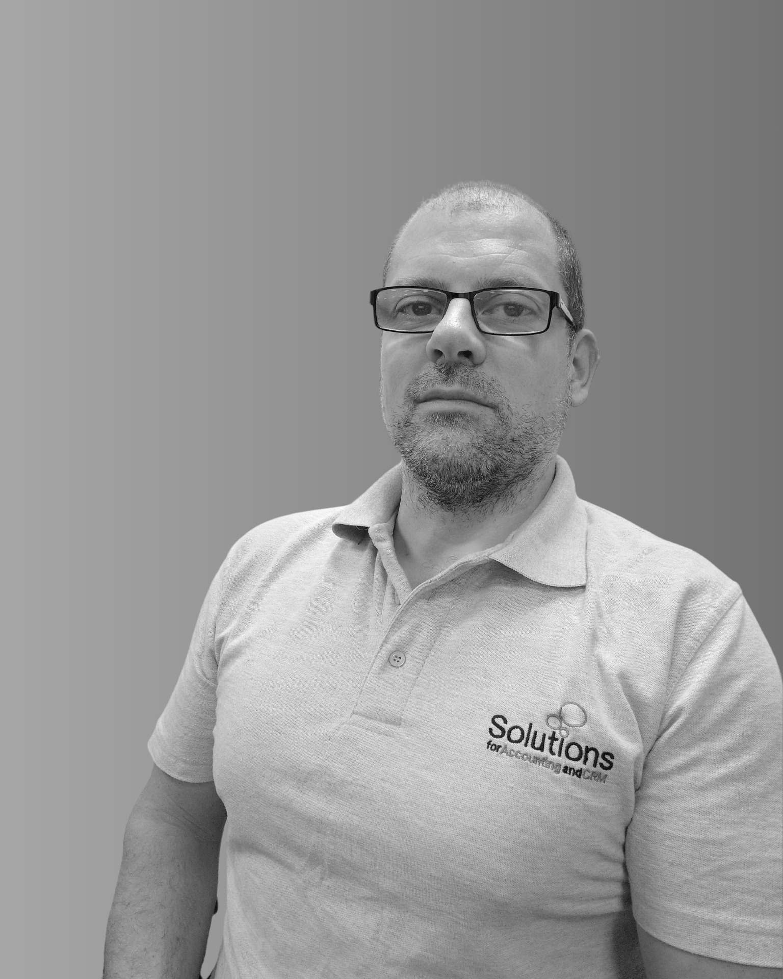 Solutions employee Julian Appleby black and white profile photo