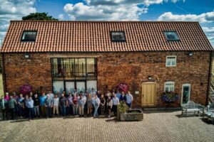 Solutions for Accounting staff photo outside the Holly Farm office