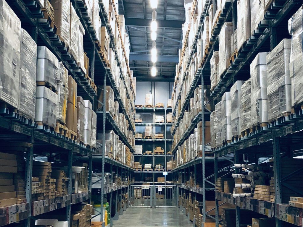 Large warehouse with shelves filled with boxes and pallets