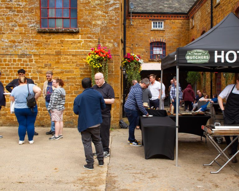 Solutions staff enjoying a BBQ at the Hook Norton brewery