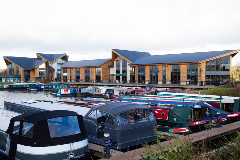 Exterior of the Derby office for Solutions for Accounting, at the Mercia Marina with several canal boats outside