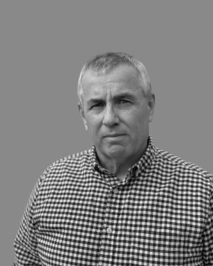 Black and white profile photo of Solutions' employee Tom Burke