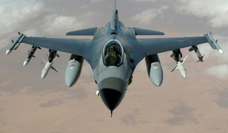 Wide-angle photo of a fighter jet flying