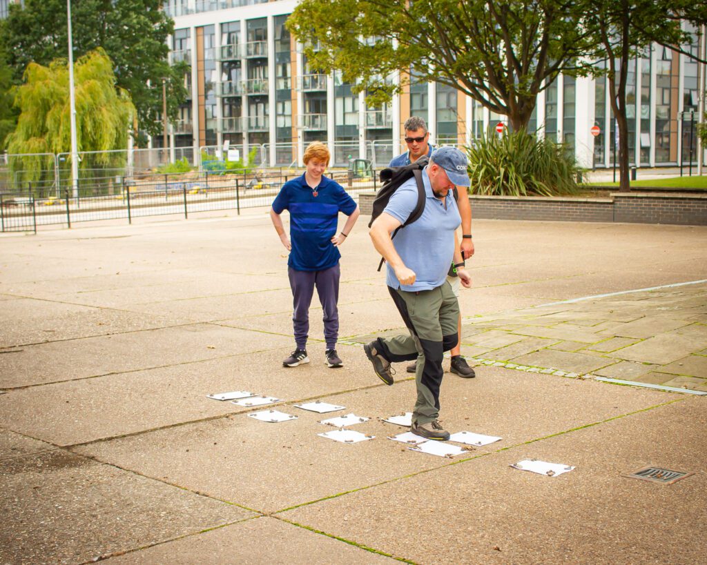 Solutions for Accounting employees doing a scavenger hunt challenge by doing hopscotch