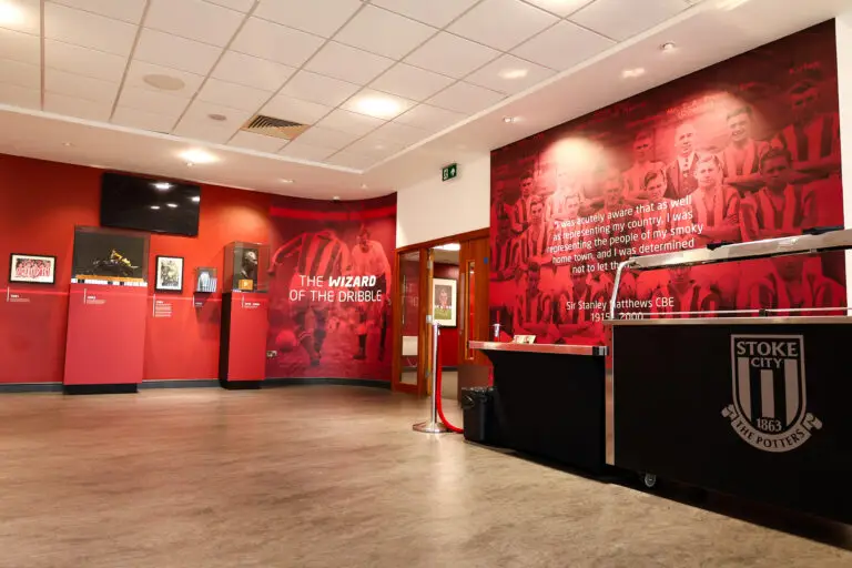 Stoke City Football Club venue interior showing team history on the team-coloured walls
