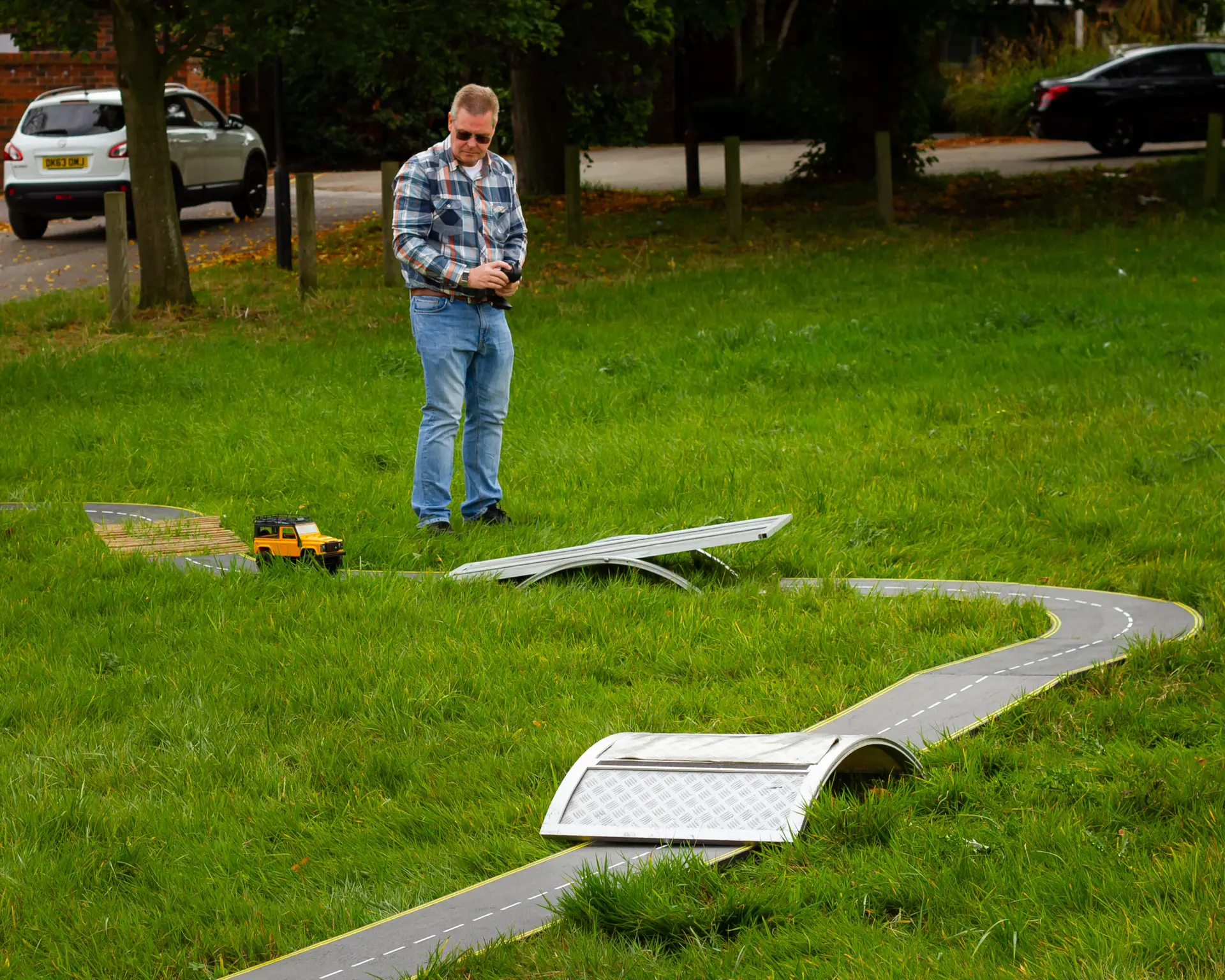 Solutions for Accounting employee driving a remote-controlled car around an obstacle course on a weekend away