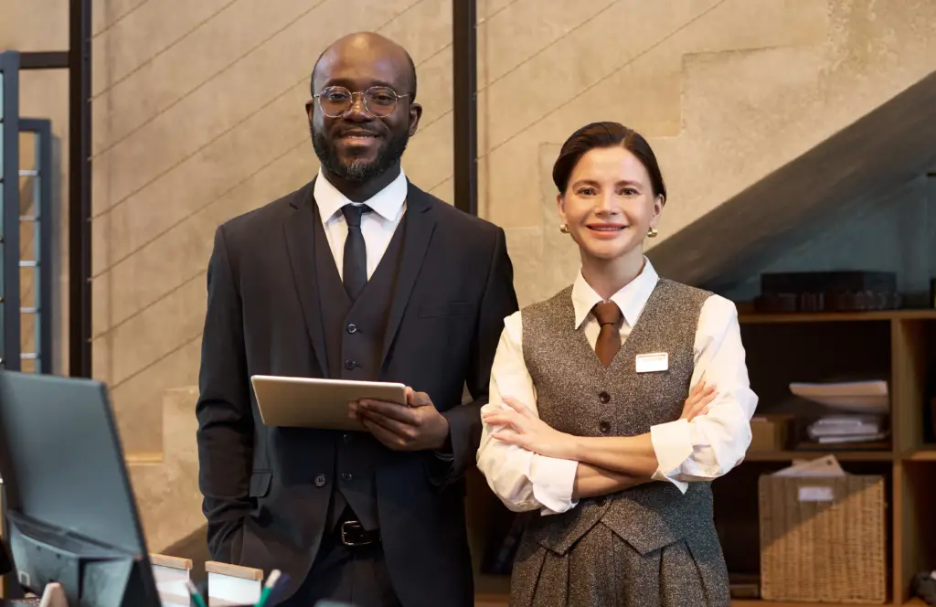 Two shop employees stood smiling for a photo